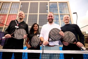Kev Till, Karen Roberts, Councillor Mark Roberts, and Ian Dixon from Life Leisure standing together at the new padel court in Stockport Exchange.